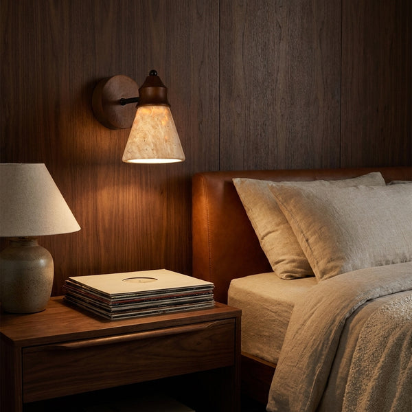 Terra sconce beside a bed