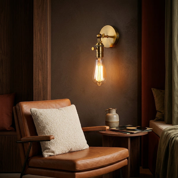 Hayden sconce above a leather reading chair
