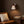 Terra sconce above a reading chair