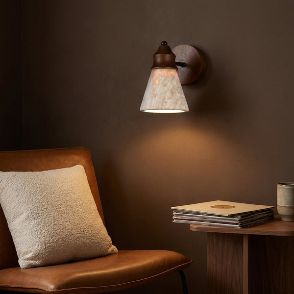 Terra sconce above a reading chair