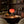 Bloom lamp on a walnut dining table