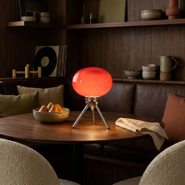 Bloom lamp on a walnut dining table