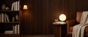 Reading corner with the Lucca opal globe lamp and the Terra stone wall sconce