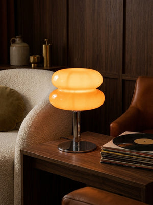 Clementine glass dome lamp glowing in a living room
