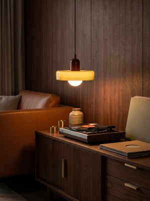 Halo pendant light above a sideboard