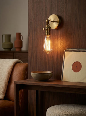 Hayden wall lamp glowing in an entryway