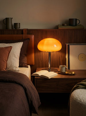 Nimbus lamp beside a bed at bedtime