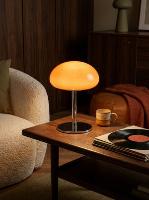 Nimbus lamp next to a boucle chair