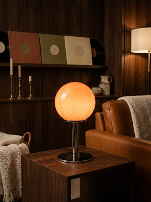 Orbit glass globe lamp glowing in a living room