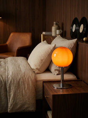 Orbit lamp on a nightstand