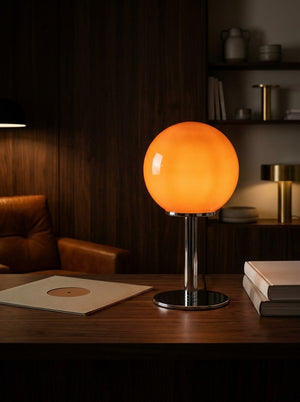 Orbit lamp on a walnut desk